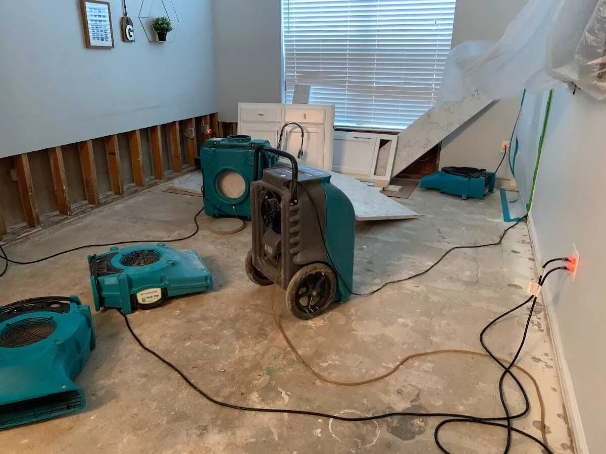 Dehumidifier in flood-cut room for Water Damage Restoration in Eldridge